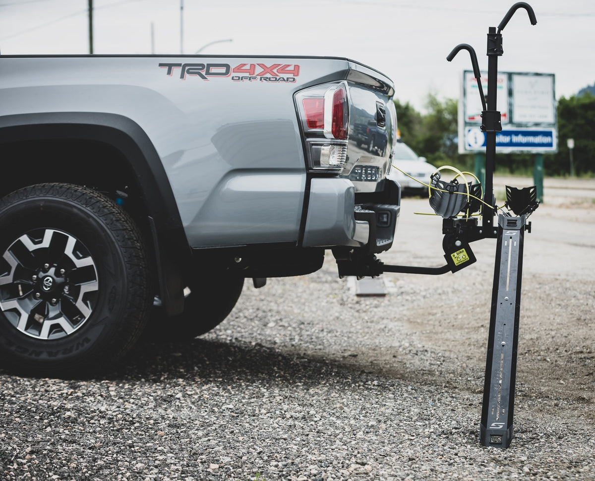 Swagman loading ramp attached to a bike rack on a pickup truck
